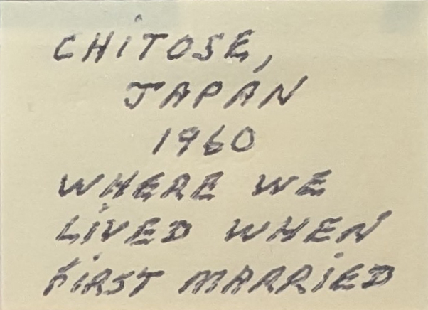 Cut-out piece of yellow post-it paper, labeled in pen with my Ojiji's shaky all-caps handwriting. It reads Chitose, Japan. 1960. Where we lived when first married.